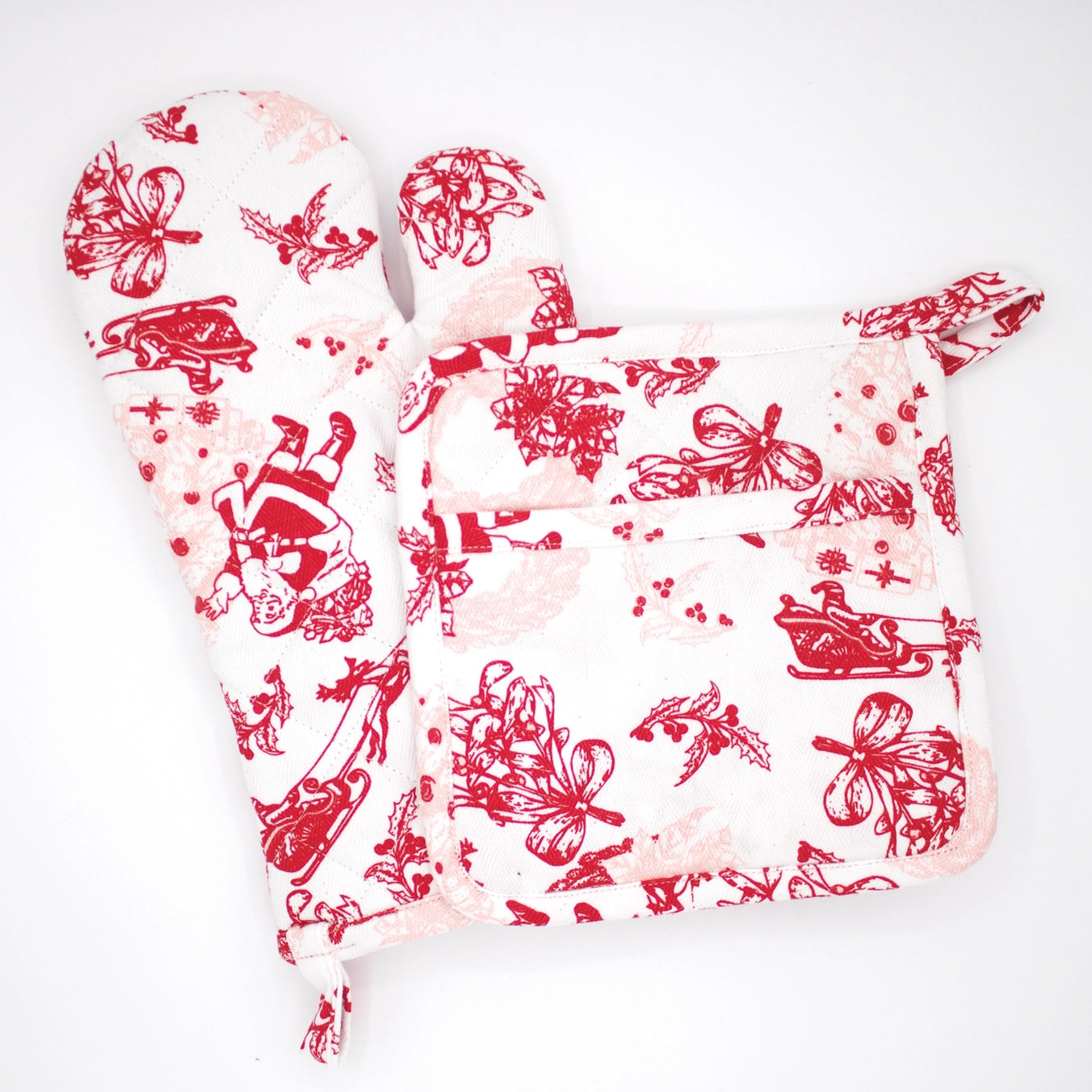 Elevate your kitchen's holiday aesthetic this Christmas with the Santa Toile Oven Mitt Set! 🤶

This 2-piece set features an elegant red toile print, perfect for adding a timeless, festive flair to your cooking. Made from 100% cotton, these mitts and potholders are both comfortable and durable, complete with hanging loops for easy storage. Pair with matching kitchen towels or pom-pom apron for a gift-worthy ensemble.

Or keep them for yourself if you're anything like us ✨