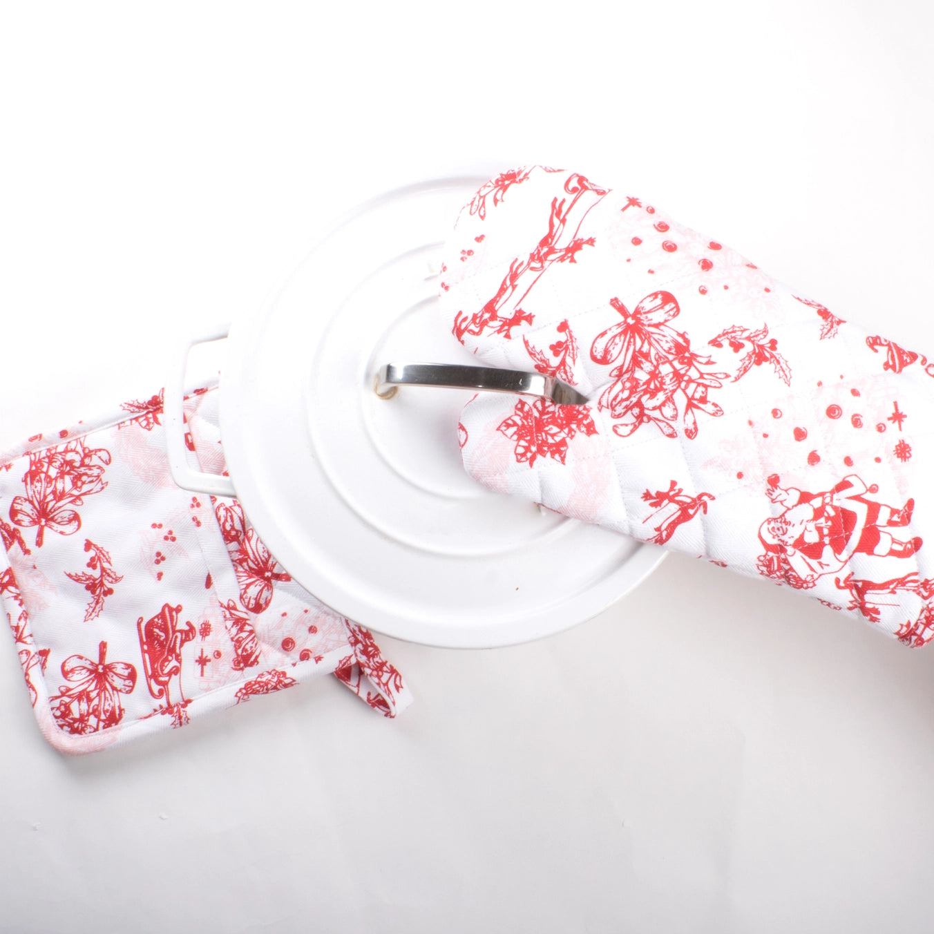 Elevate your kitchen's holiday aesthetic this Christmas with the Santa Toile Oven Mitt Set! 🤶

This 2-piece set features an elegant red toile print, perfect for adding a timeless, festive flair to your cooking. Made from 100% cotton, these mitts and potholders are both comfortable and durable, complete with hanging loops for easy storage. Pair with matching kitchen towels or pom-pom apron for a gift-worthy ensemble.

Or keep them for yourself if you're anything like us ✨