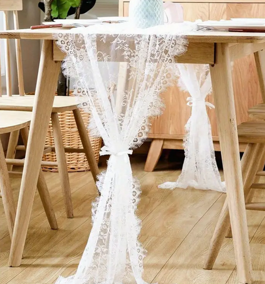 Add a whimsical touch to your dining table with our vintage-inspired white lace table runner! ✨

Its authentic coquette design brings a playful, charming touch to any meal, effortlessly elevating your tablescape 🌸 Perfect for the hosts who have a love for the aesthetics!&nbsp;

Hot Style Tip: It's giving rustic chic or garden party weddings &amp; events 🍽️💐

Dimensions: 28" x 120"&nbsp;📏